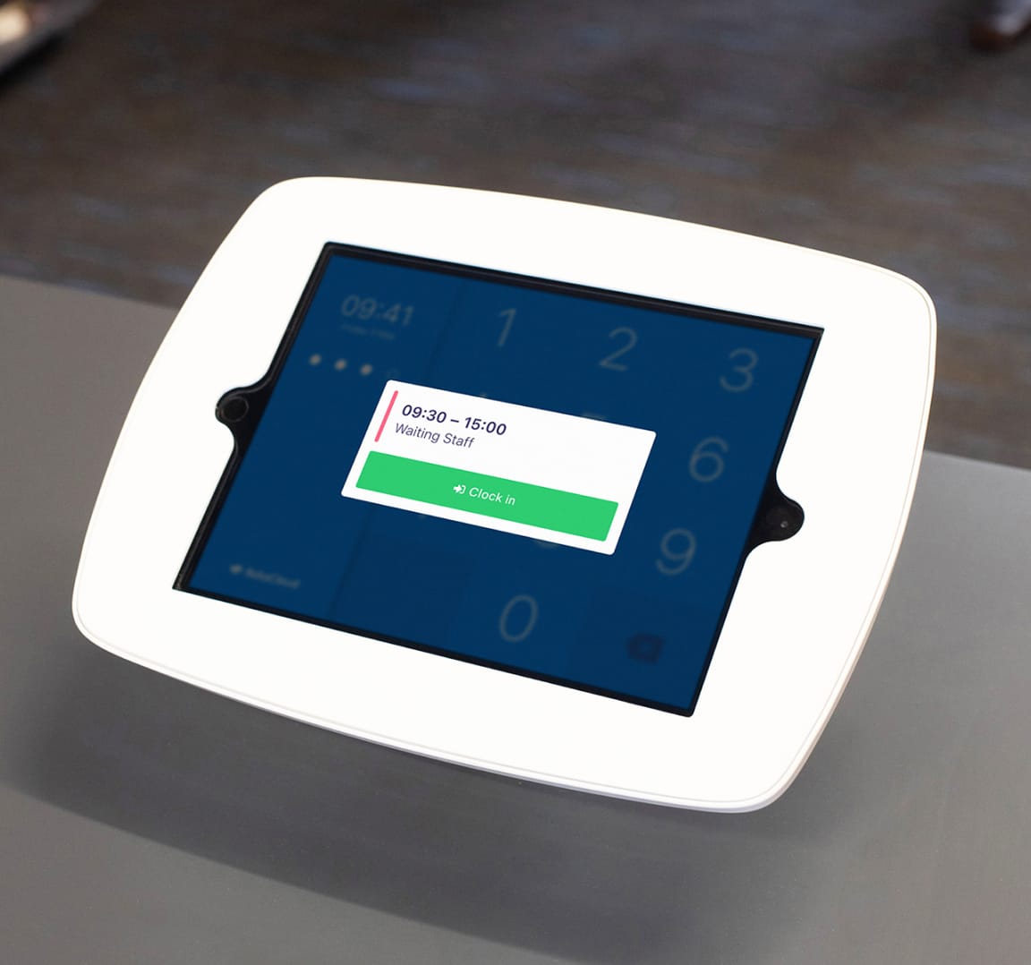 Employee having
their photo taken on a clocking in terminal with shift details
and